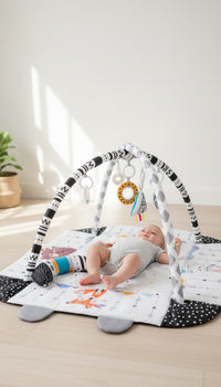 Подлога за играње со активности за бебиња – Multisensory Baby Play Gym