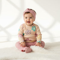 Комплет блуза со цветови и траперки со трака за коса