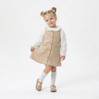 Корд фустан со срце џебови и бела блуза